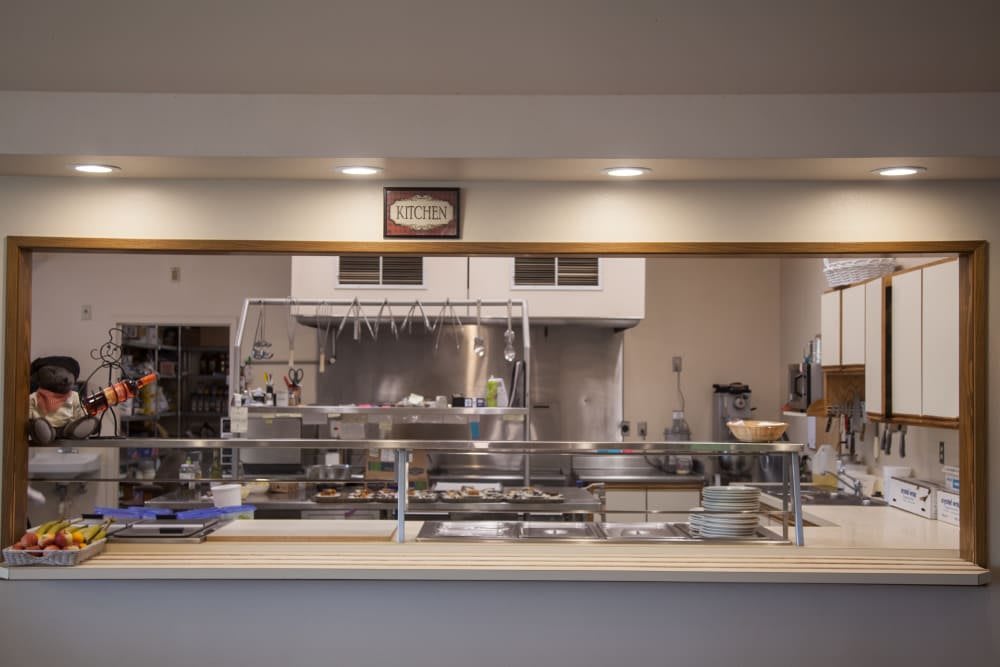 An industrial kitchen with various cooking equipment and utensils on display.