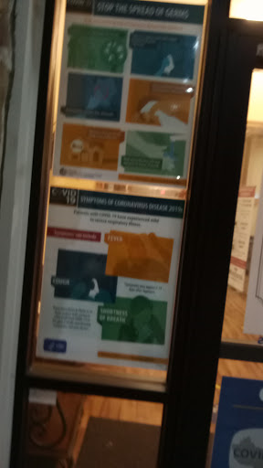 Informational posters displayed in a window.