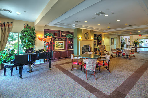 A welcoming lounge area featuring comfortable seating, a piano, and decorative elements that create a cozy atmosphere.