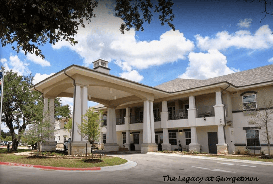 A grand entrance with large columns at a modern building.