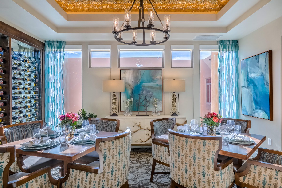 An elegant dining room with a beautifully set table and stylish decor.