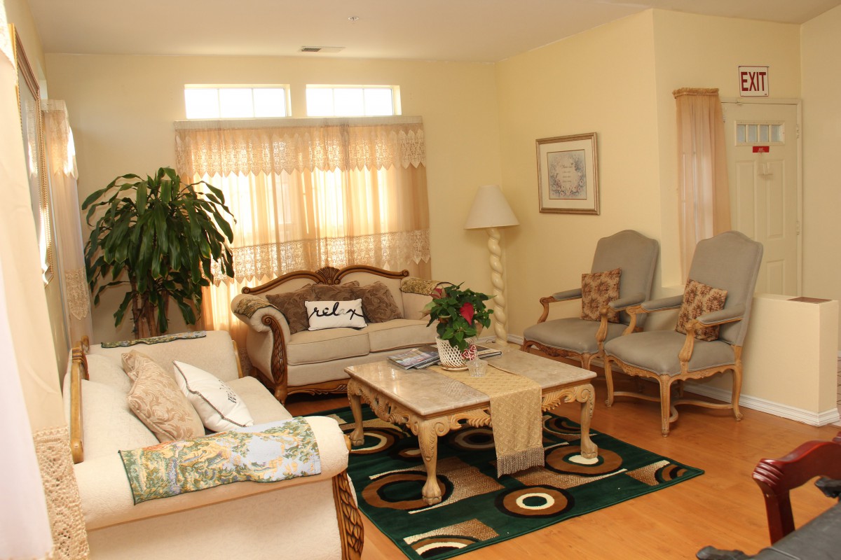 A cozy living room with elegant furniture and warm lighting.