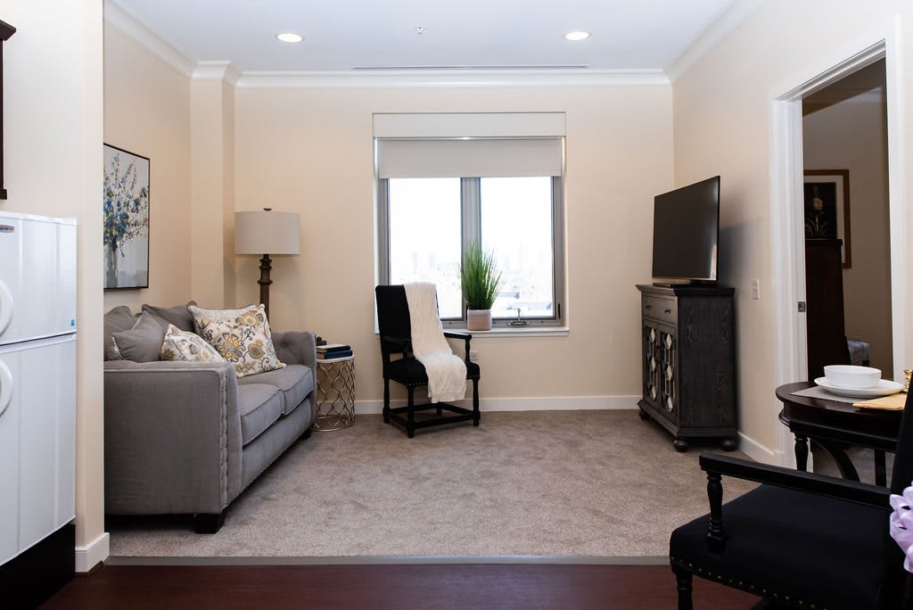 Cozy living room with a comfortable sofa and a TV.