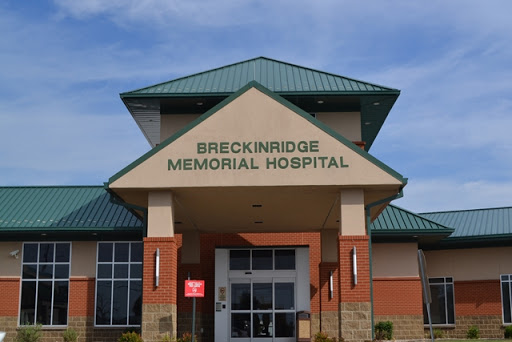 Facade of Breckinridge Memorial Hospital under a clear sky.