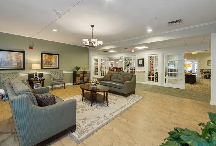 A cozy living room with stylish furniture and warm lighting.
