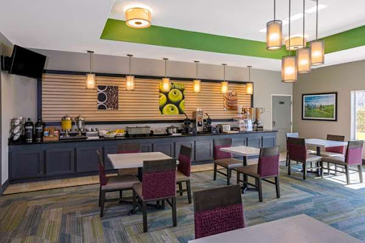 A modern breakfast area featuring inviting furniture and contemporary lighting.