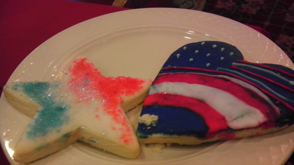 Patriotic-themed sugar cookies decorated with red, white, and blue designs.