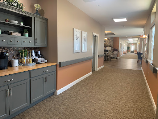 A well-designed hallway in a healthcare facility, showcasing a warm and inviting atmosphere.