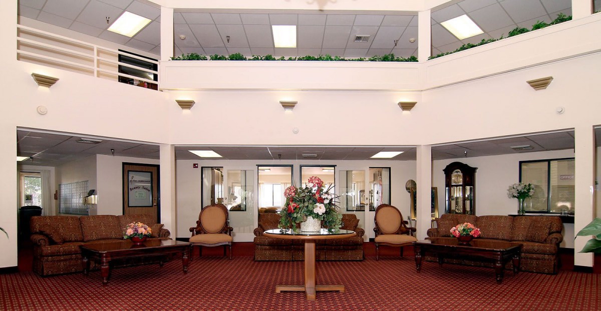 A spacious lobby area with elegant furniture and decor.