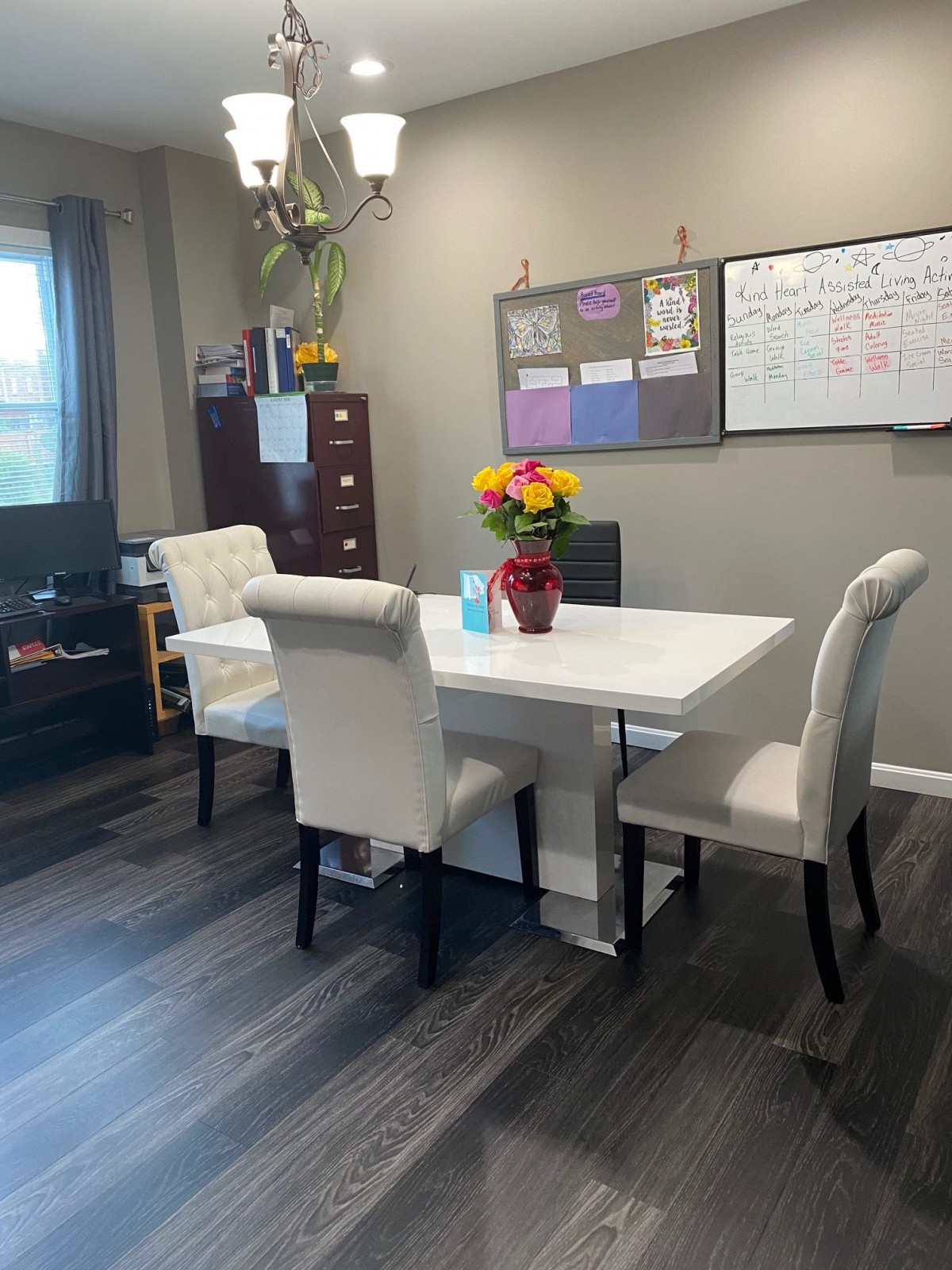 A well-organized office space with a table, chairs, and decorative elements.