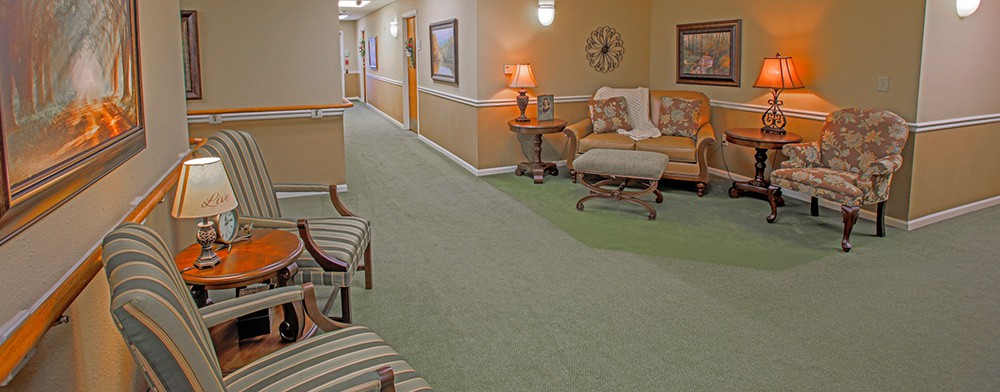 A cozy hallway with comfortable seating and warm lighting.