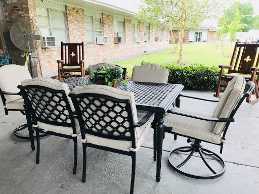 A cozy outdoor seating area featuring a table and chairs, perfect for enjoying the fresh air.