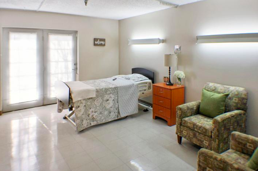 A cozy and well-lit patient room in a medical facility.