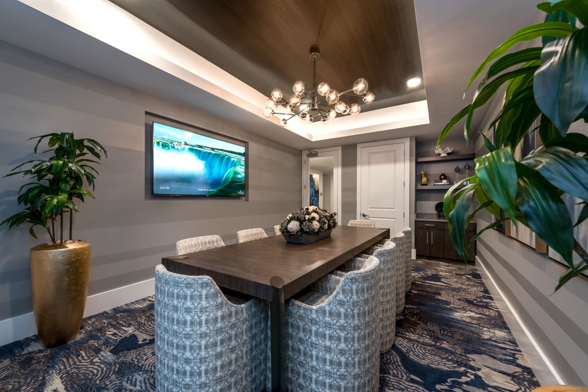 A modern dining room with stylish decor and elegant lighting.