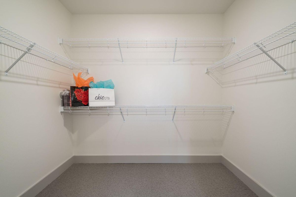 An empty closet with wire shelving ready for organization.
