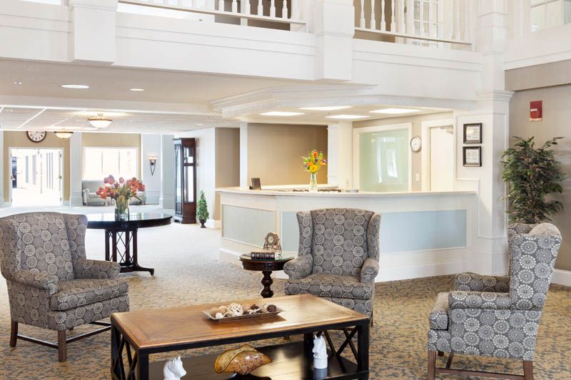 A modern lobby area with comfortable seating and a reception desk.