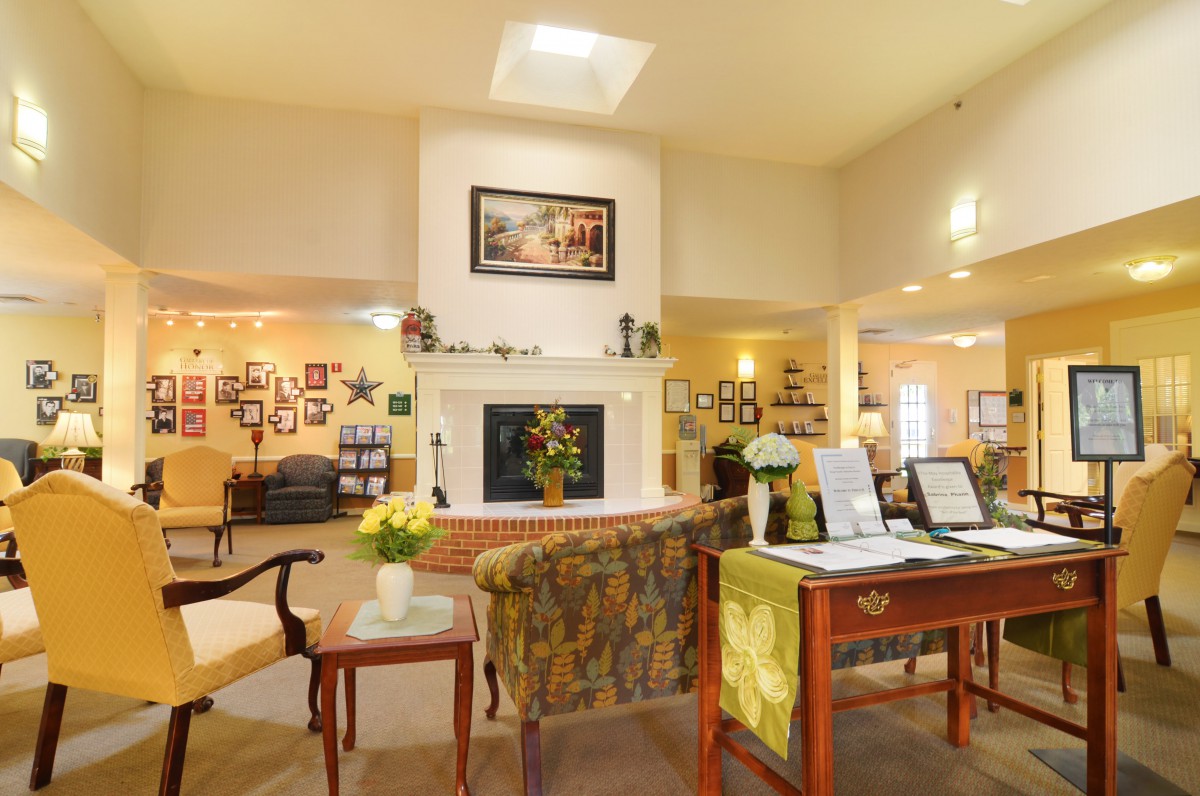 A cozy living room with a fireplace and elegant decor.