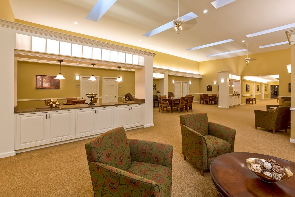 A spacious and modern interior with ample seating and ceiling lights.