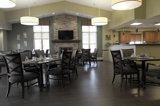 A spacious and modern dining area featuring elegant furniture and ample natural light.