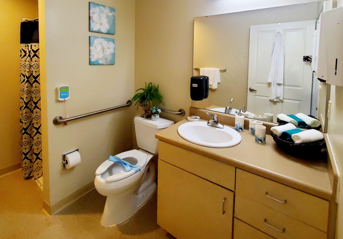 A clean and organized bathroom with essential amenities.