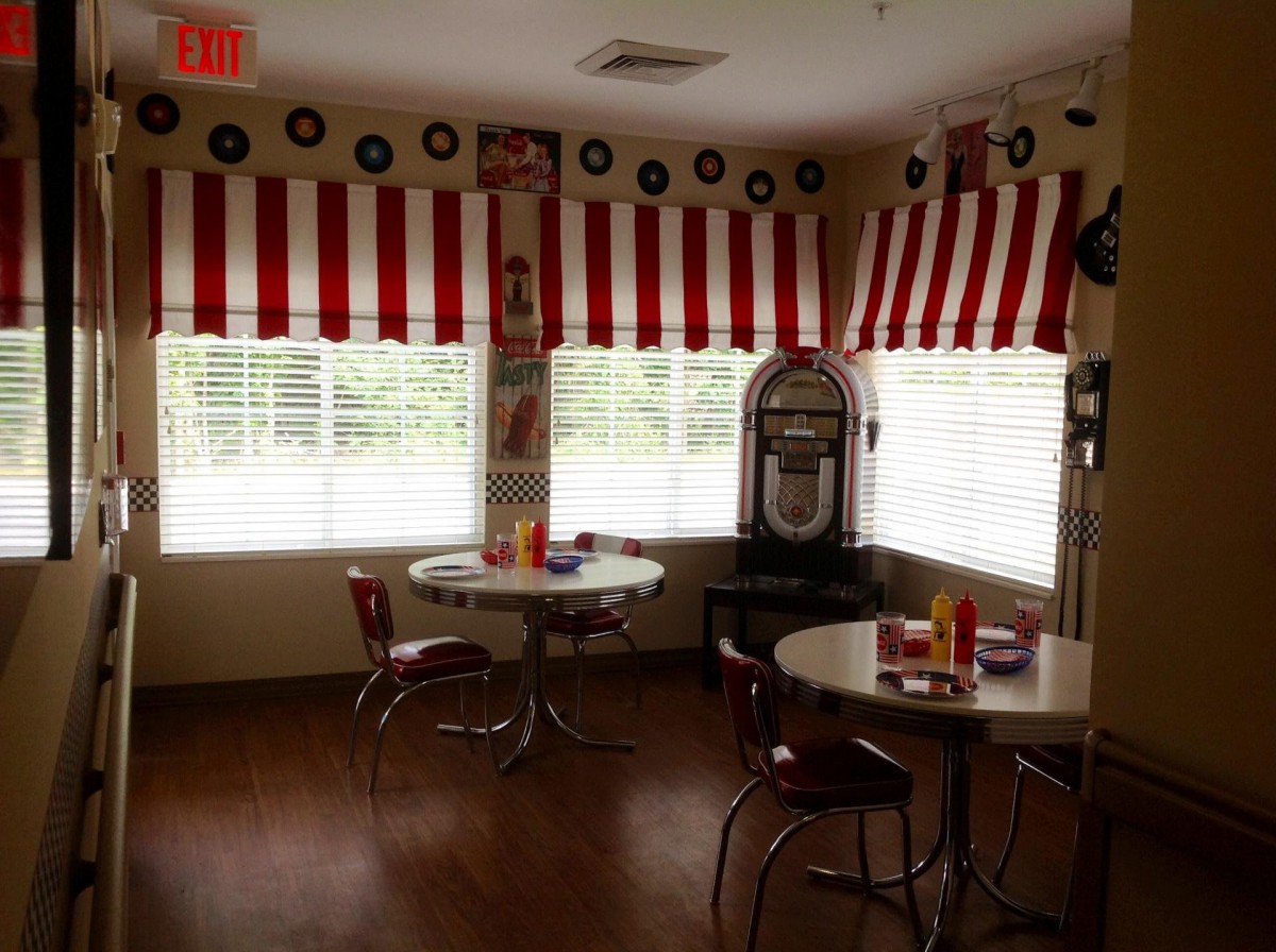 A cozy retro diner with a jukebox and vintage decor.