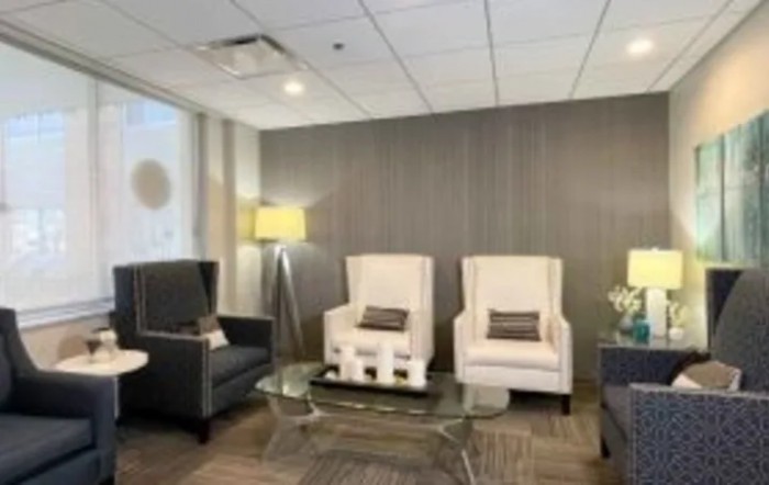 A modern waiting room with comfortable seating and stylish decor.