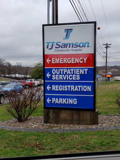 Sign directing to various services at TJ Samson Community Hospital.