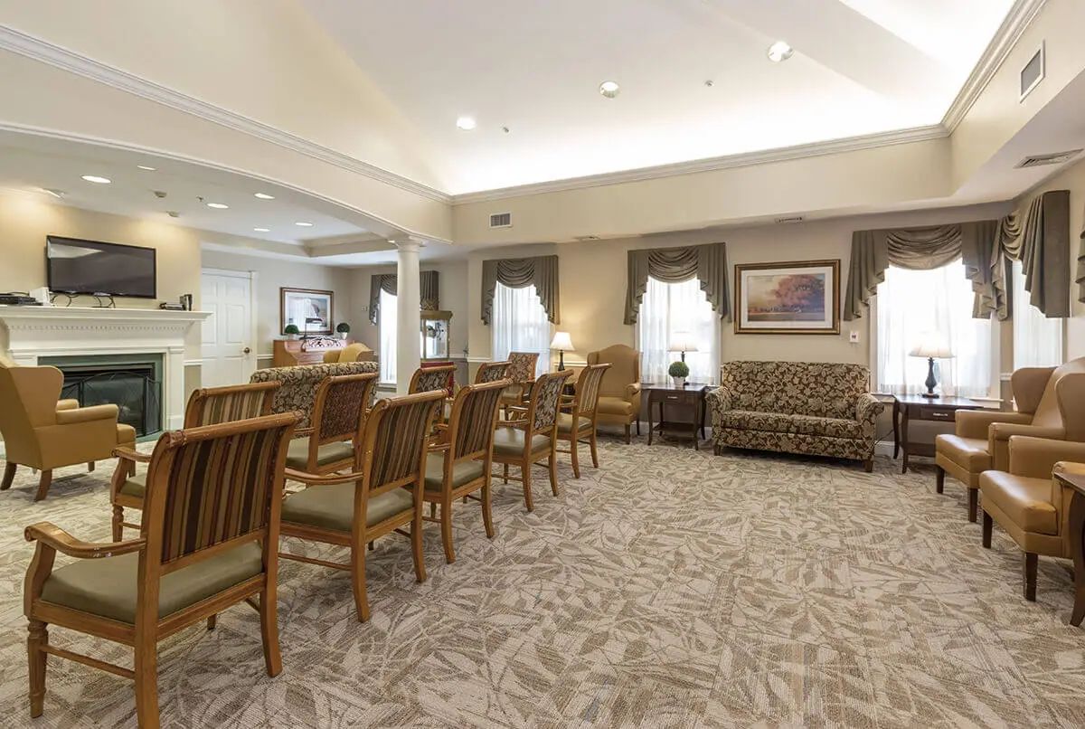 A spacious waiting room with comfortable seating and elegant decor.
