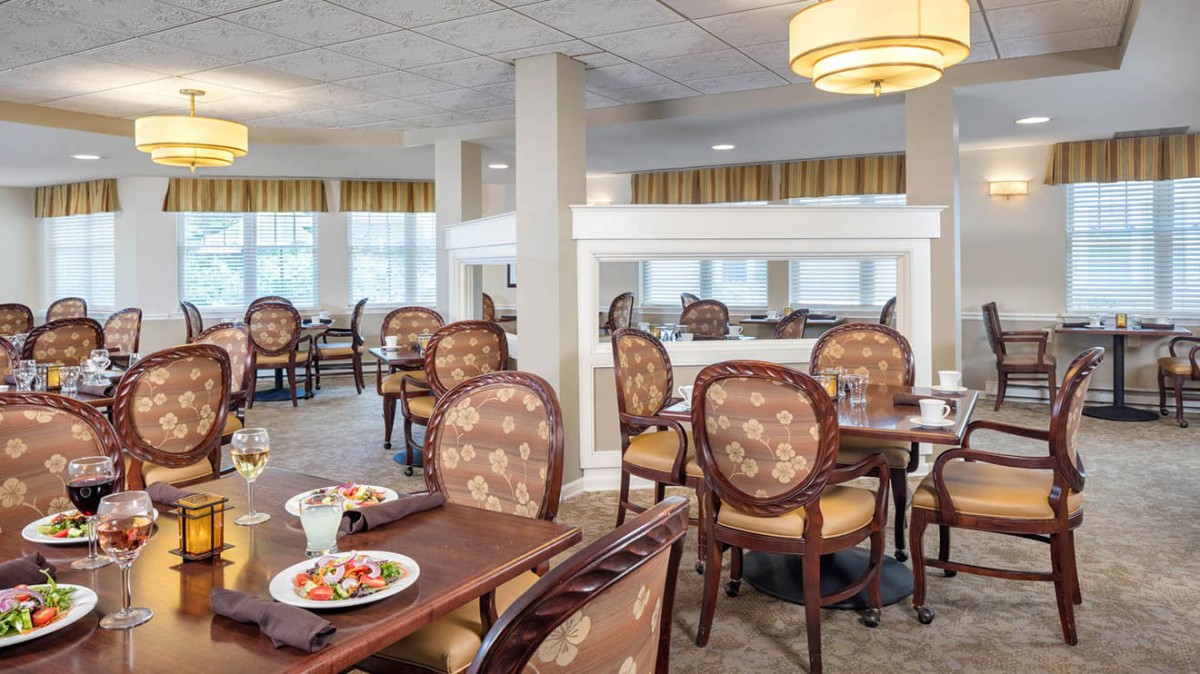 A well-furnished dining area with elegant seating and decor.