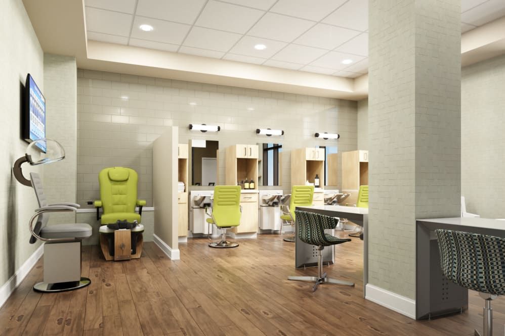 A modern dental office with green chairs and individual workstations.