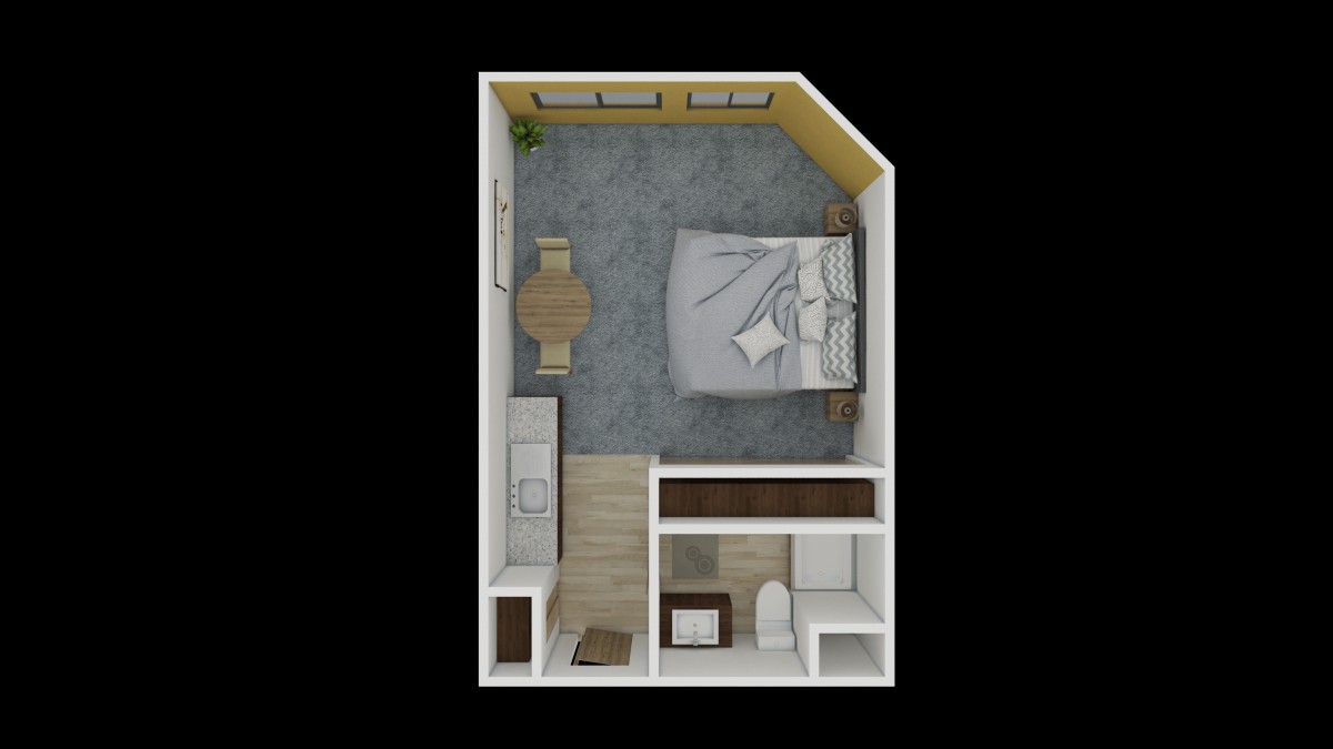 A top-down view of a compact apartment floor plan featuring a bedroom, small dining area, and bathroom.