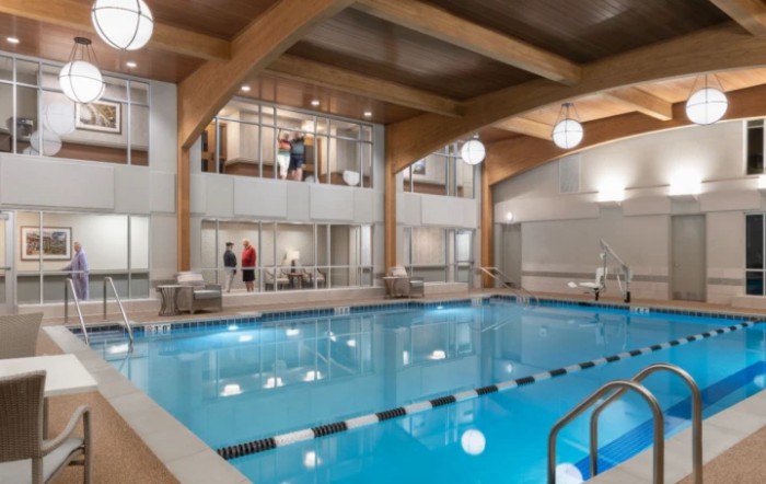 A luxurious indoor swimming pool with modern architectural design.