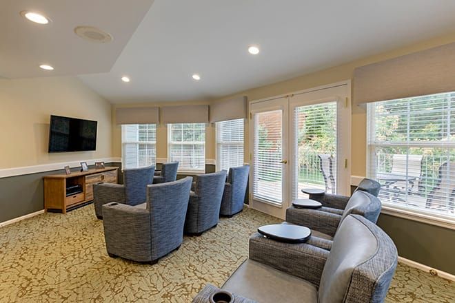 A modern living room with comfortable seating and ample natural light.
