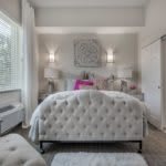 A modern and luxurious bedroom with elegant decor and soft lighting.