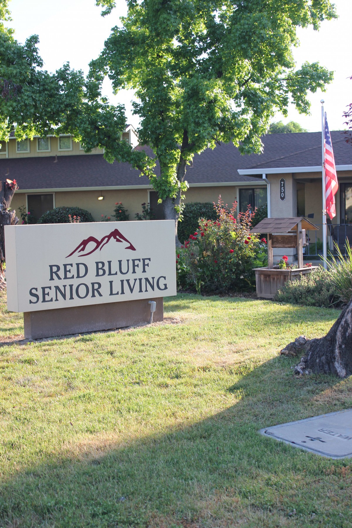 Entrance sign and building of Red Bluff Senior Living facility.