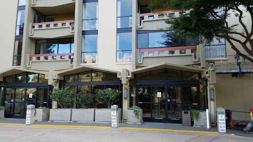 A modern commercial building with large glass windows and a welcoming entrance.