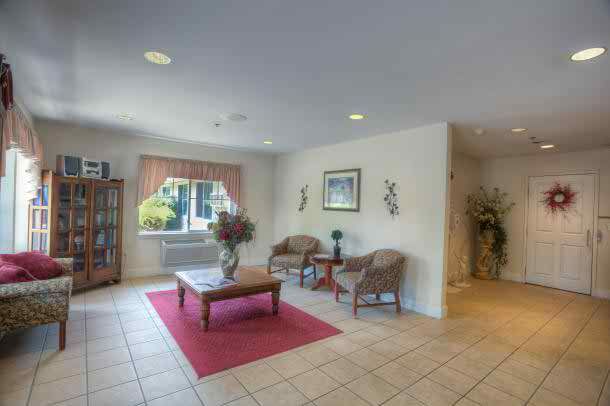 A spacious lobby area featuring comfortable seating and tasteful decor.