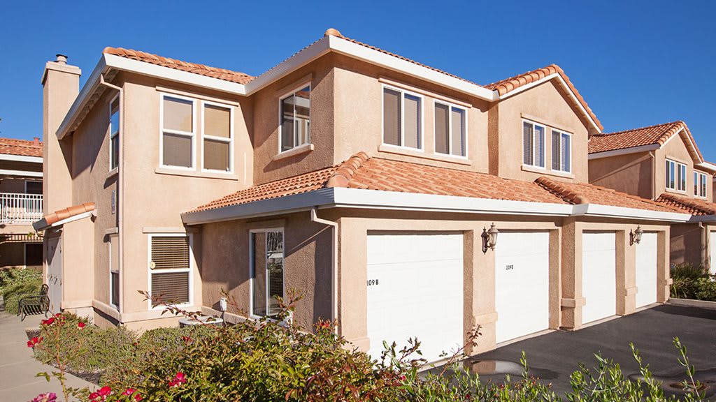 A two-story suburban house with a double garage.