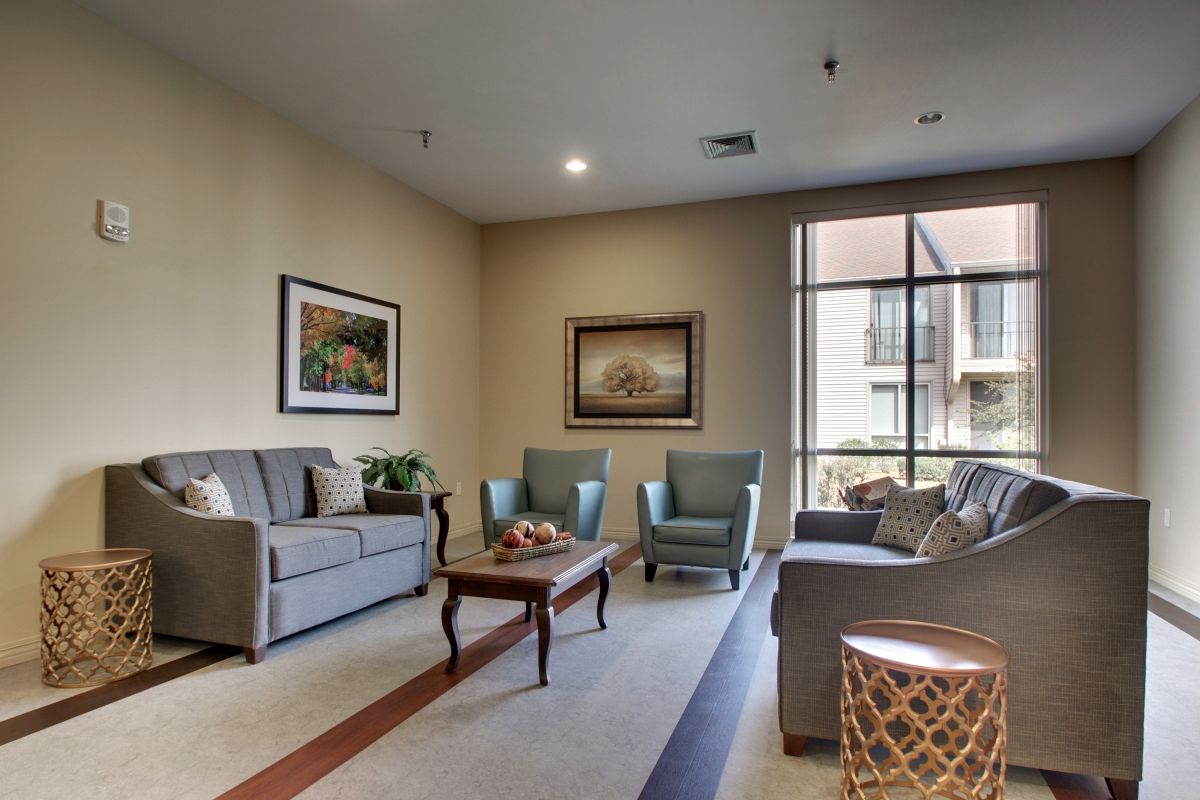 A cozy living room with comfortable seating and warm lighting.