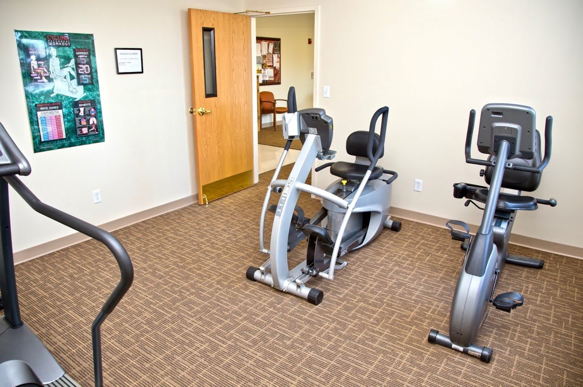 A small fitness room featuring stationary bikes and exercise equipment.