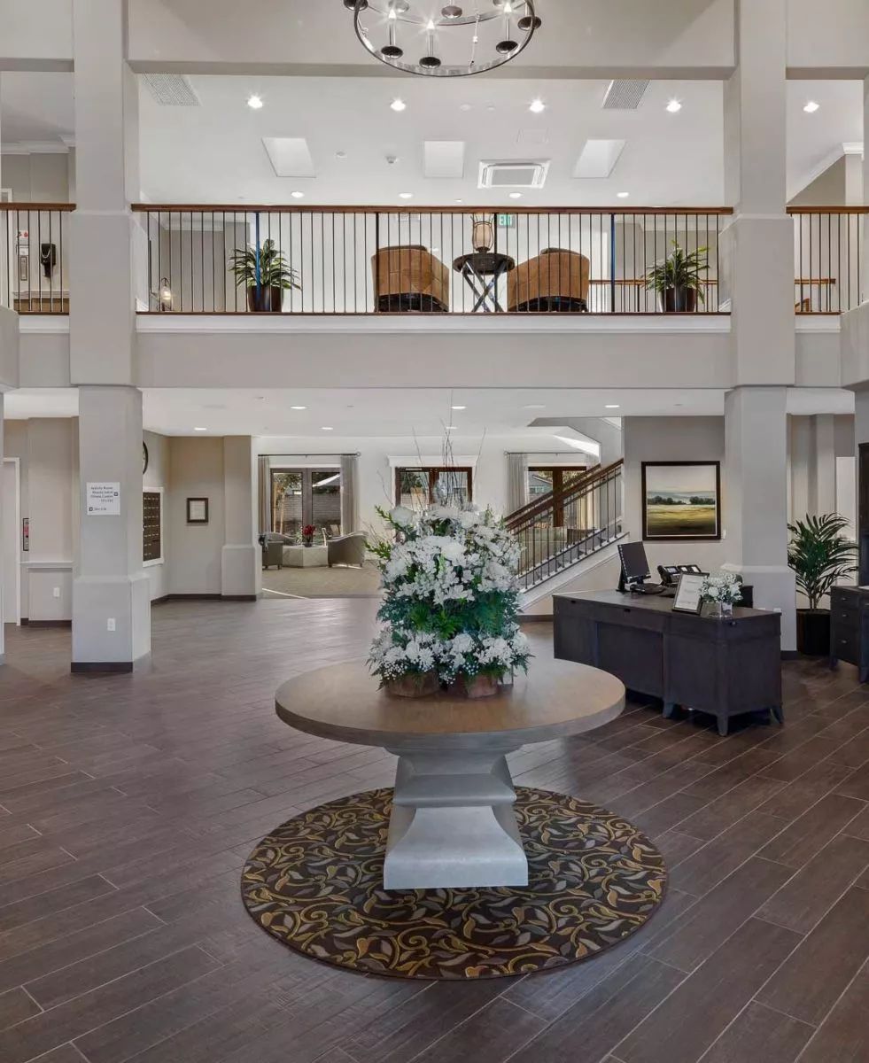 Spacious lobby with elegant decor and seating area.