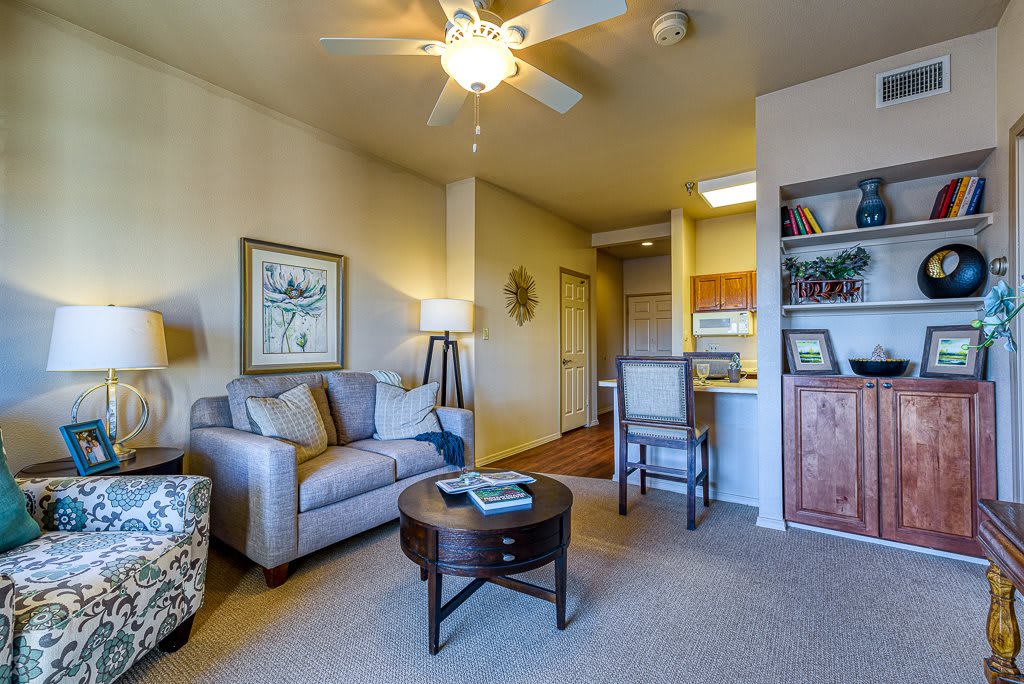 A cozy living room with a sofa, coffee table, and elegant decor.
