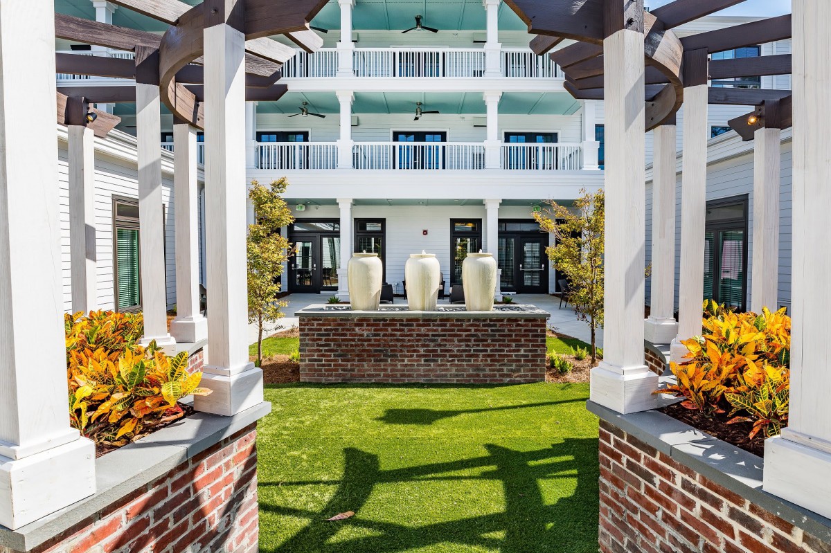 Beautiful hotel courtyard with a central fountain and elegant architecture.