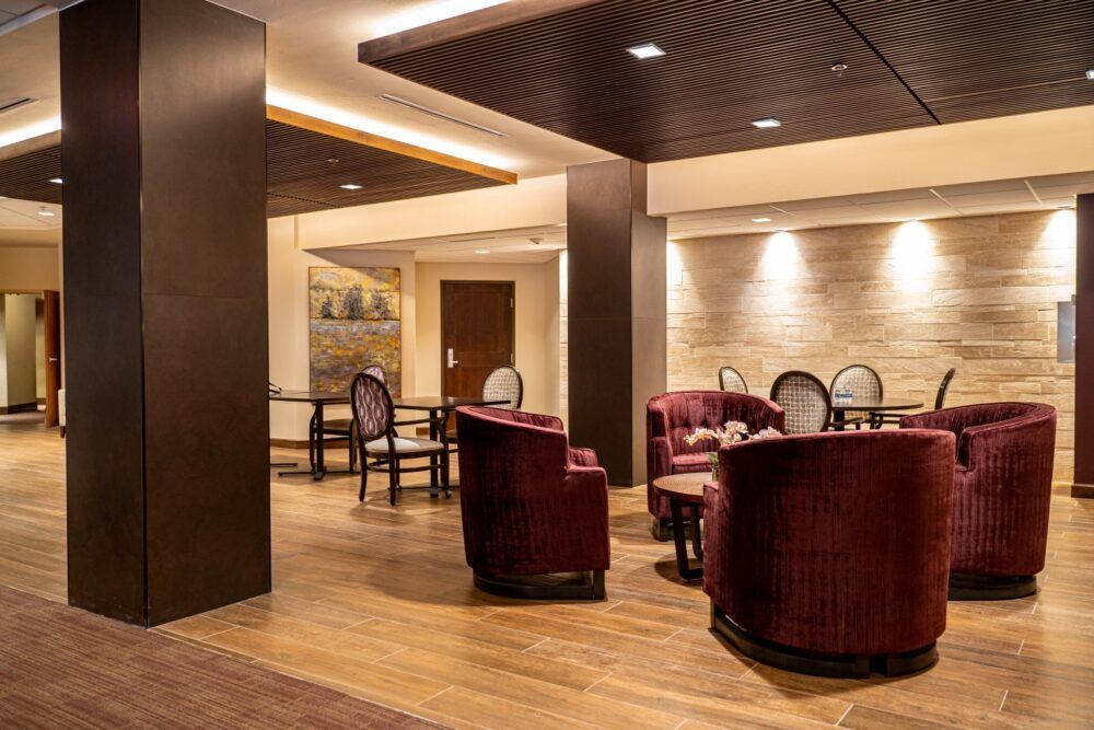 A modern and cozy lounge area with comfortable seating and elegant interior design.