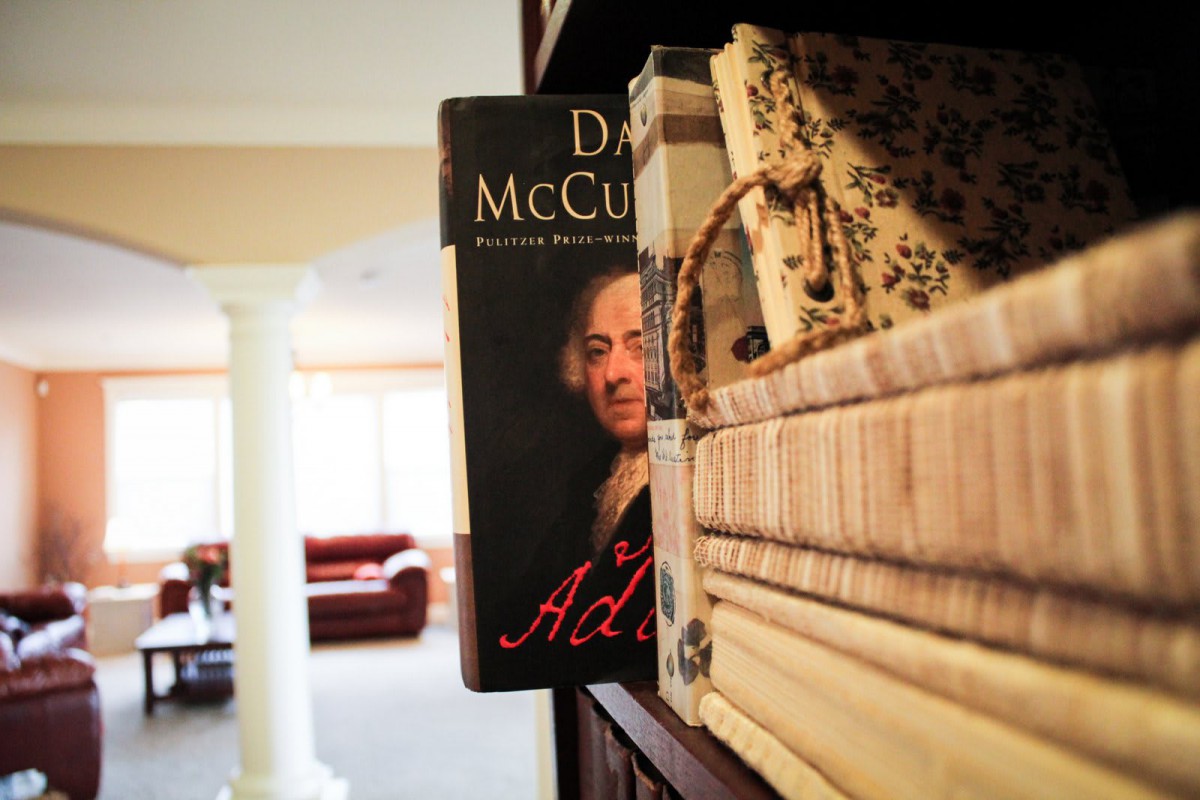 A bookshelf with a prominently displayed biography on it.