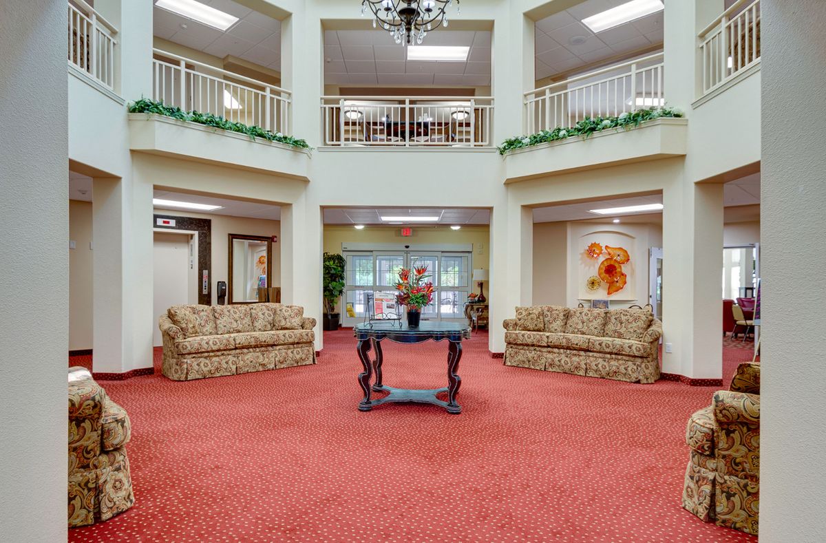 A spacious lobby with comfortable sofas and decorative elements.
