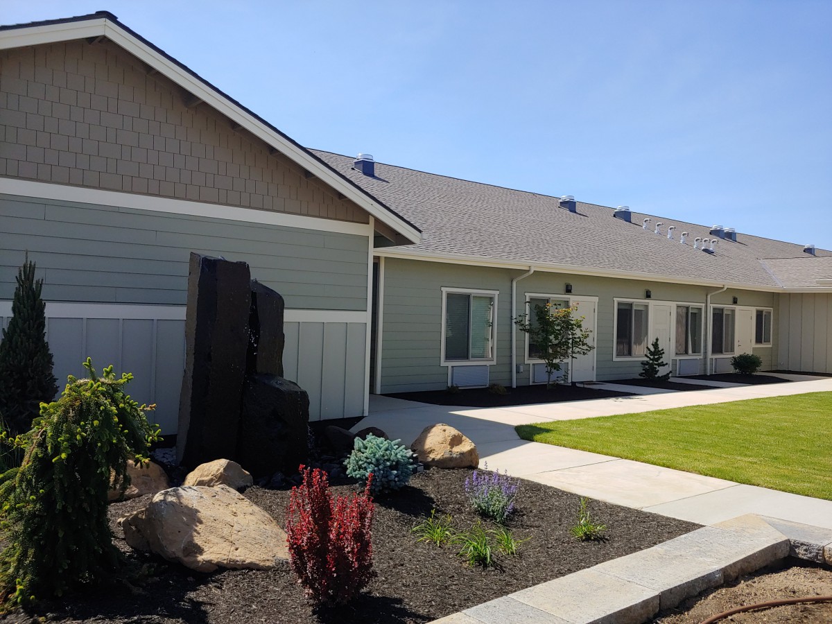 A well-maintained residential property with neat landscaping and a vibrant garden.