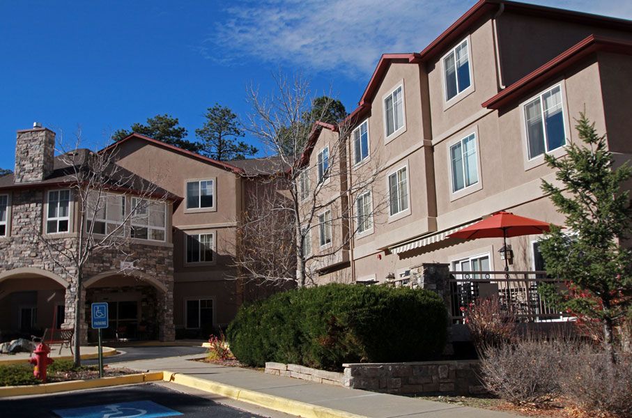 A view of a hotel building under a clear blue sky.