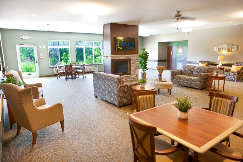 A spacious and well-lit living room with comfortable seating and modern decor.