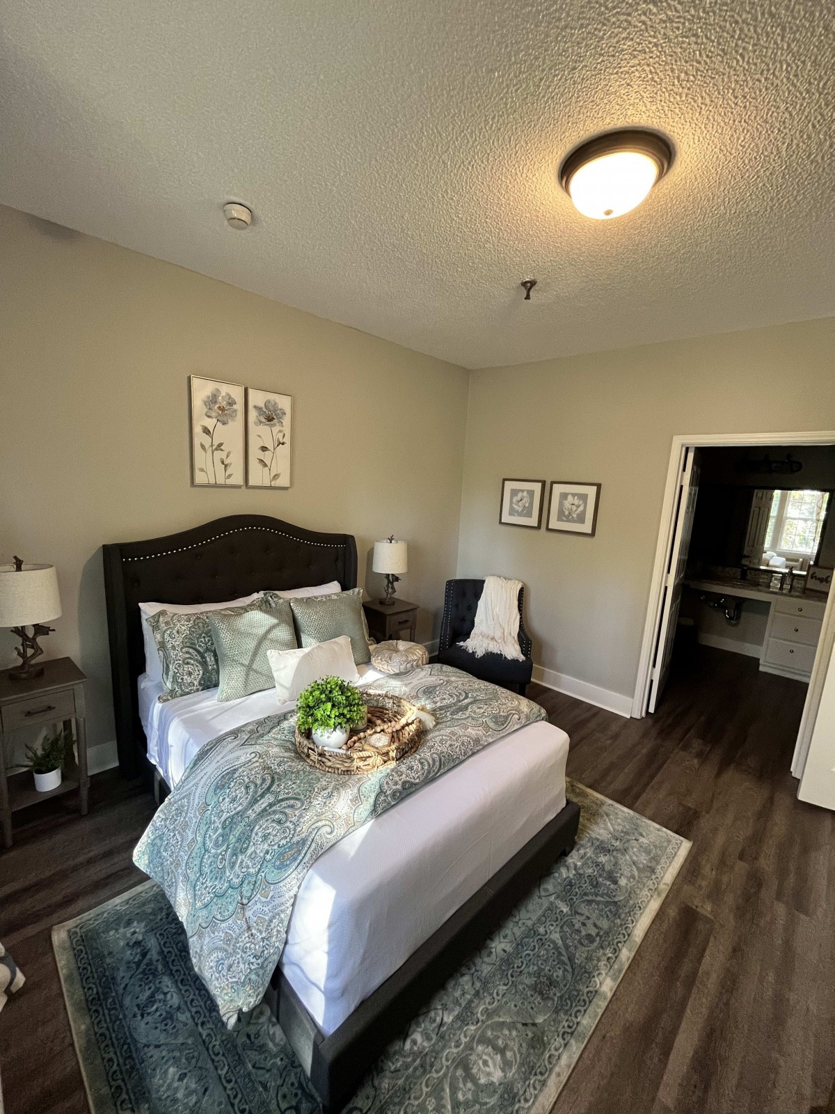 A modern and cozy bedroom with stylish decor and natural lighting.